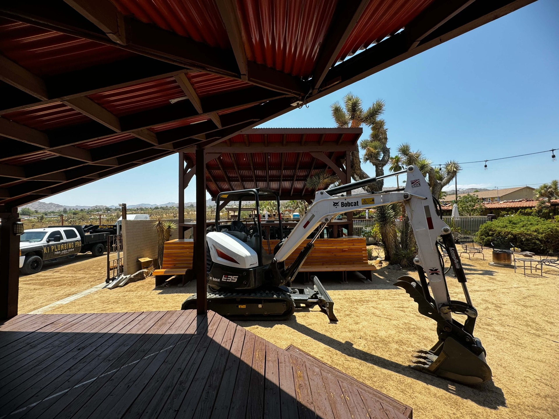 A1 Plumbing Pros truck and excavator at job site